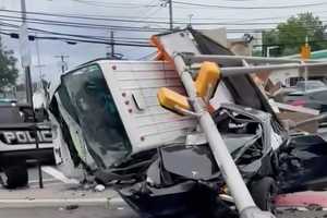 Truck Plows Through Intersection, Crushes Tesla In Bergenfield (DEVELOPING)